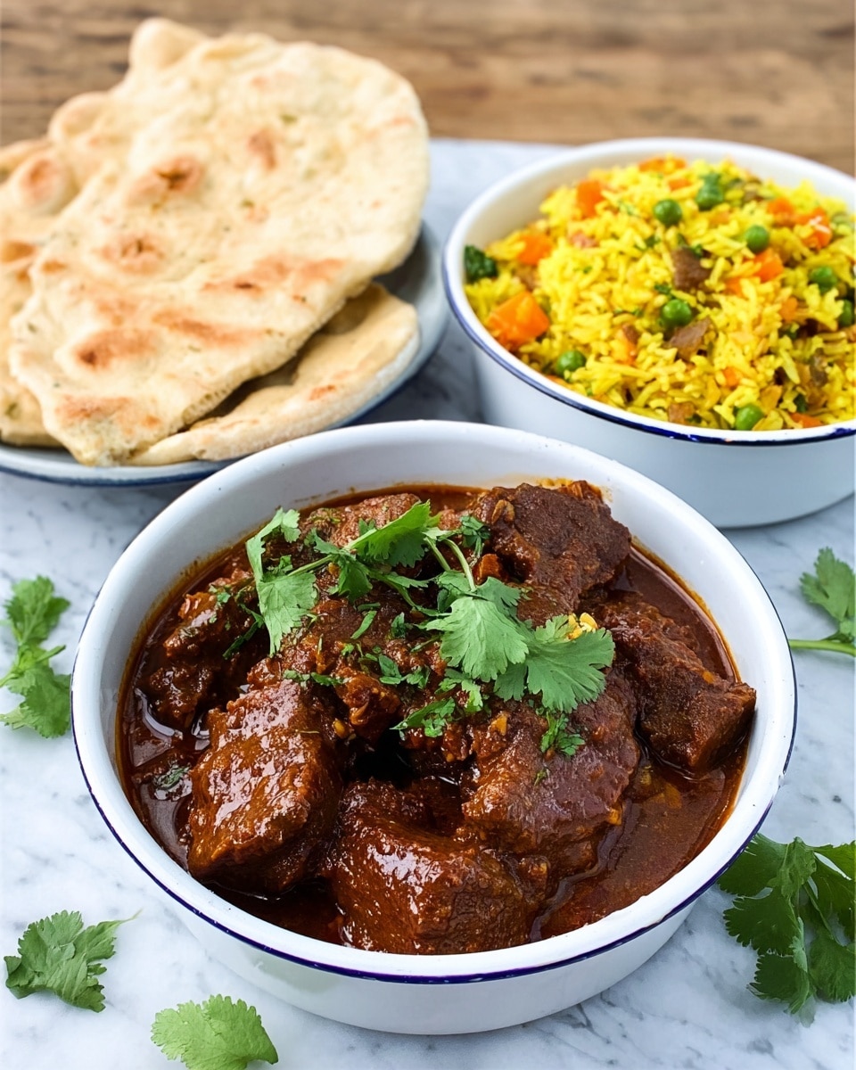 The image shows three white enamel bowls with blue rims placed on a white marbled surface. The largest bowl in front contains a rich brown curry with chunks of meat or vegetables, topped with fresh green cilantro leaves. To the right, there is a smaller bowl filled with bright yellow rice mixed with small pieces of orange carrot and green herbs. On the left, another white bowl holds two pieces of thick, soft-looking flatbread stacked slightly unevenly. Some cilantro leaves are scattered around the bowls, adding a fresh green touch. Photo taken with an iphone --ar 4:5 --v 7