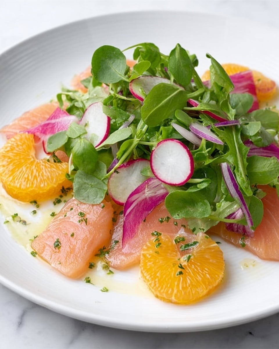A white plate holds a fresh salad with three clear layers: the bottom layer has thin, translucent slices of light orange salmon arranged flat, the middle layer has thinly sliced round radishes with white centers and red edges scattered evenly, and the top layer is a mix of bright green watercress leaves and stems with some thin slices of purple onion peeking through, plus bright yellow orange segments placed around the greens. The whole dish glistens slightly with a light dressing. The plate sits on a white marbled surface. photo taken with an iphone --ar 4:5 --v 7