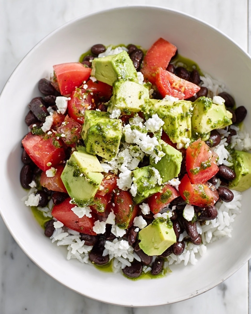 A white bowl filled with several layers of food is shown from above. The bottom layer is white rice with a soft texture. Resting on the rice are black beans, dark and smooth, scattered unevenly. Chunks of green avocado with a creamy texture and pieces of red tomato with a juicy look sit on top of the beans. White soft cheese is crumbled and spread generously over the salad. A drizzle of green herb sauce is seen on the cheese and avocado, adding a fresh touch. The bowl is placed on a white marbled surface. photo taken with an iphone --ar 4:5 --v 7