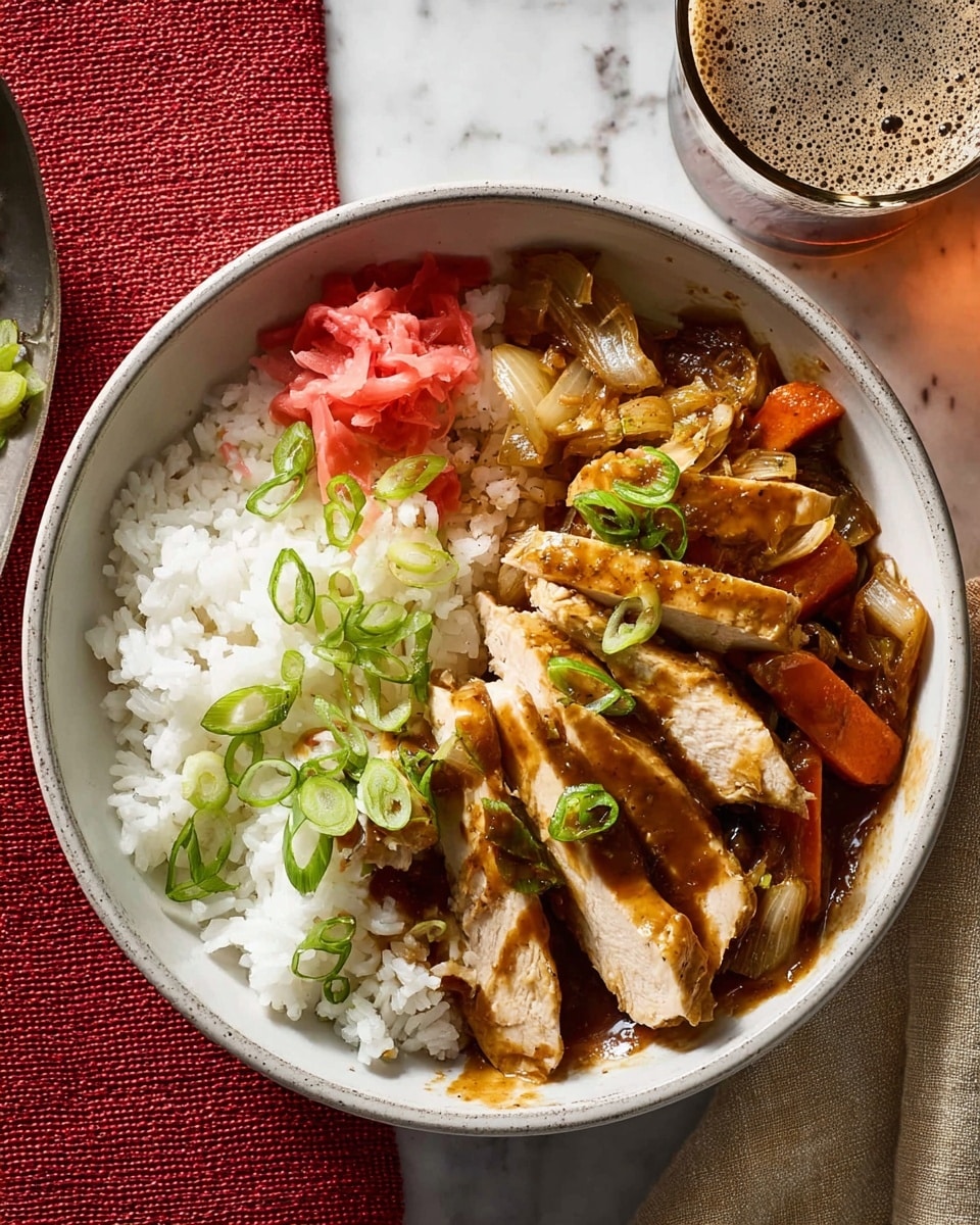 A white speckled bowl holds a serving of white rice on one side, topped with thin slices of light green scallions and a small pile of pink pickled ginger. Next to the rice, there are sliced pieces of cooked chicken covered with a rich brown sauce mixed with roasted vegetables, including golden brown onions and carrots, all garnished with more scallion slices. The bowl sits on a red textured mat, next to a glass of light amber beer and a beige cloth napkin, all set on a white marbled surface. photo taken with an iphone --ar 4:5 --v 7