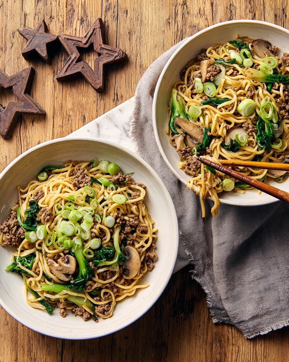 Two white bowls filled with stir-fried noodles, resting on a soft cloth over a wood surface. Each bowl contains layers starting with light yellow noodles as the base, mixed with browned ground meat scattered evenly throughout. On top, there are sautéed light brown mushroom slices and bright green bok choy leaves folded into the dish. Fresh green onion slices are sprinkled across the top, adding a fresh touch. One bowl has wooden chopsticks resting on its edge, lifting some noodles. In the background, two rust-colored metal stars lie on the wood surface. Photo taken with an iphone --ar 4:5 --v 7