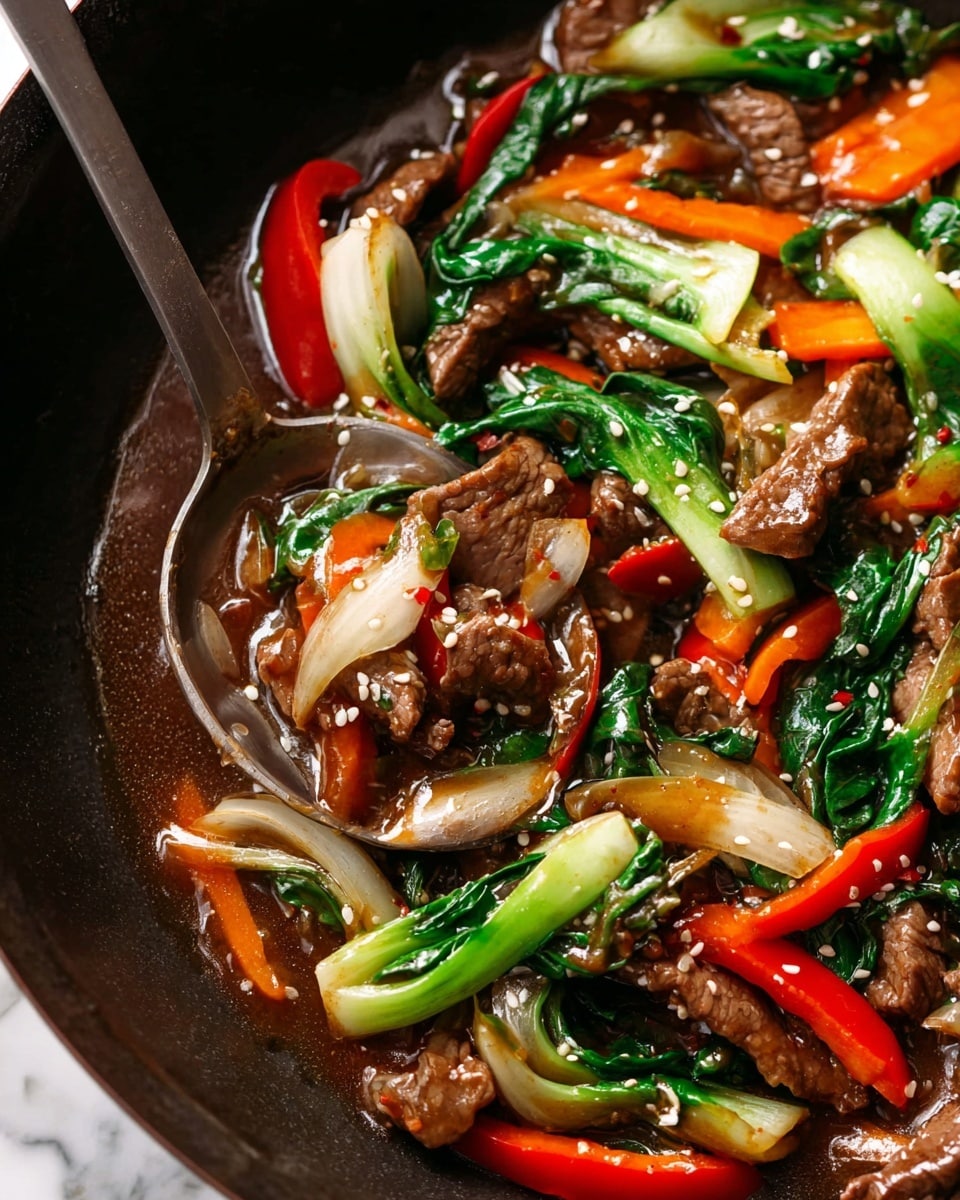 The dish shows a close-up of a stir-fry with three main layers: at the bottom is a glossy brown sauce filling most of a dark wok; above the sauce are bright, colorful vegetables like green bok choy, red bell pepper strips, orange carrot pieces, and light tan sliced onions scattered evenly; the top layer consists of tender, cooked brown beef slices sprinkled with white sesame seeds. A silver metal spoon rests in the wok on the right side, partially covered by the sauce and ingredients. The dish and wok sit on a white marbled surface. photo taken with an iphone --ar 4:5 --v 7