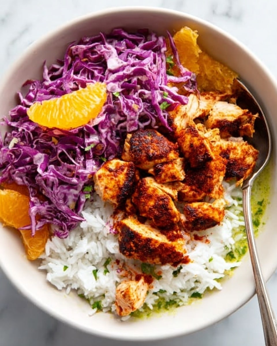 A white bowl holds a layered dish starting with a base of white rice on the right side, topped with a piece of grilled salmon in the center, showing crispy brown skin. On the left, there are bright orange chunks of roasted sweet potato resting on a bed of shredded purple cabbage and small green leaves for garnish. A pale green sauce pools around the rice and salmon, filling the bottom of the bowl. A silver fork is placed on the right edge inside the bowl, touching the rice. The bowl sits on a white marbled surface. Photo taken with an iphone --ar 4:5 --v 7